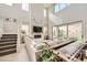 Open-concept living area with fireplace, large windows, and sliding doors to the backyard at 421 Malpaso St, Las Vegas, NV 89138