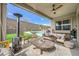 Outdoor patio featuring a seating area with a view of the backyard pool, perfect for relaxation at 421 Malpaso St, Las Vegas, NV 89138