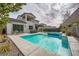 Beautiful backyard pool and spa with built in seating and a covered patio, perfect for entertaining at 421 Malpaso St, Las Vegas, NV 89138