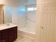 Bathroom featuring a tub-shower combination and sleek vanity at 4274 Tarim St, Las Vegas, NV 89147