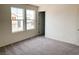 This bedroom offers plush carpeting, neutral walls and two windows to allow ample natural light at 4274 Tarim St, Las Vegas, NV 89147