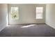 Bright bedroom with two windows and neutral carpet at 4274 Tarim St, Las Vegas, NV 89147