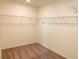 Carpeted walk-in closet with wire shelving for ample storage at 4274 Tarim St, Las Vegas, NV 89147