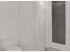 This bathroom features a sleek glass shower with white tiles and a door to the outside at 4436 Mural Glen Ct, North Las Vegas, NV 89084
