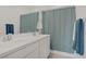 Bathroom with double sinks and modern fixtures, paired with a bathtub and shower combination at 4436 Mural Glen Ct, North Las Vegas, NV 89084