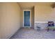 Inviting front porch with stylish stone accents, comfortable seating, and a decorative front door at 4436 Mural Glen Ct, North Las Vegas, NV 89084