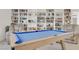 The game room features a bright pool table and a large bookcase at 4436 Mural Glen Ct, North Las Vegas, NV 89084