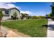 Expansive community green space with well-maintained grass, walking paths, and neighborhood homes at 4436 Mural Glen Ct, North Las Vegas, NV 89084