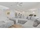 Spacious living room with open layout, connecting to the kitchen, and a comfortable sectional sofa at 4436 Mural Glen Ct, North Las Vegas, NV 89084