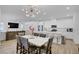 Open concept living spaces with island, dining area, and living room at 4436 Mural Glen Ct, North Las Vegas, NV 89084