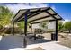 Shaded picnic area with tables offers a perfect spot for community gatherings and outdoor dining at 4436 Mural Glen Ct, North Las Vegas, NV 89084