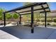 Shaded picnic area with multiple tables for community enjoyment and outdoor relaxation at 4436 Mural Glen Ct, North Las Vegas, NV 89084