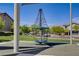 Neighborhood playground features a unique rope climbing structure, perfect for outdoor play at 4436 Mural Glen Ct, North Las Vegas, NV 89084