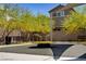 Community playground featuring a merry-go-round, benches, and shade structures for residents at 4436 Mural Glen Ct, North Las Vegas, NV 89084