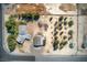 Overhead aerial shot highlighting a home, detached garage, and the layout of a spacious property with mature trees at 481 Jarvis Rd, Pahrump, NV 89060