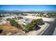 Lush aerial view showcases a home, detached garage, and verdant tree coverage in a charming neighborhood with mountain views at 481 Jarvis Rd, Pahrump, NV 89060