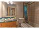 Modest bathroom with a single sink vanity, standard toilet, and a shower-tub combo with tiled walls at 481 Jarvis Rd, Pahrump, NV 89060