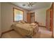 Cozy bedroom featuring a comfortable bed, closet, and warm natural lighting at 481 Jarvis Rd, Pahrump, NV 89060