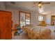 Bedroom with window and wood trim and is well-lit with a ceiling fan at 481 Jarvis Rd, Pahrump, NV 89060