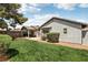 Enjoy a lush green backyard with mature trees, desert landscaping, and shade at 4813 Canadian Dr, Las Vegas, NV 89130