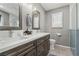This is a full bathroom that features double sinks, plenty of storage, and tile floors at 4813 Canadian Dr, Las Vegas, NV 89130