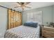 Charming bedroom with a sliding barn door and shuttered window offers modern comfort and privacy at 4813 Canadian Dr, Las Vegas, NV 89130