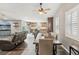 Bright, open concept living space with dining area, comfortable seating, and seamless flow to the modern kitchen at 4813 Canadian Dr, Las Vegas, NV 89130