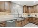 Well-appointed kitchen featuring custom cabinetry, stainless steel appliances, and a large farmhouse sink at 4813 Canadian Dr, Las Vegas, NV 89130