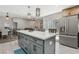 Open-concept kitchen featuring a large island, modern appliances, and seamlessly connected to the living and dining areas at 4813 Canadian Dr, Las Vegas, NV 89130