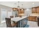 Spacious kitchen with an island, stainless steel appliances, and easy access to the outdoor living area at 4813 Canadian Dr, Las Vegas, NV 89130