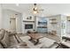 Comfortable living room featuring a fireplace, a mounted TV, and stylish decor at 4813 Canadian Dr, Las Vegas, NV 89130