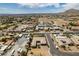 An aerial view shows desert homes, RV parking, with a pool and putting green at 5120 Lone View Pl, Las Vegas, NV 89149