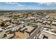 A wide aerial showcases a backyard with a pool and putting green at 5120 Lone View Pl, Las Vegas, NV 89149