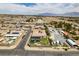 Expansive aerial view of the neighborhood showcasing a pool and putting green on the property at 5120 Lone View Pl, Las Vegas, NV 89149