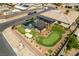 Backyard aerial view showcases a pool, patio, putting green, and desert landscaping at 5120 Lone View Pl, Las Vegas, NV 89149