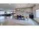 Dining area with stylish chairs, modern lighting, and open access to the living room at 5120 Lone View Pl, Las Vegas, NV 89149