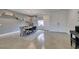 Chic dining area with a modern light fixture, and views of the front yard at 5120 Lone View Pl, Las Vegas, NV 89149