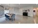 Stylish dining area, seamlessly connected to the living area and adorned with a piano at 5120 Lone View Pl, Las Vegas, NV 89149