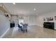 Elegant dining area with a contemporary light fixture and a piano at 5120 Lone View Pl, Las Vegas, NV 89149