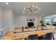 Bright dining room with stylish light fixture and wood table, perfect for gatherings at 5120 Lone View Pl, Las Vegas, NV 89149