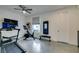Spacious home exercise room with ceiling fan and equipped with modern fitness equipment at 5120 Lone View Pl, Las Vegas, NV 89149