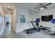 Bright exercise room features modern equipment, closet, and access to other areas of the home at 5120 Lone View Pl, Las Vegas, NV 89149