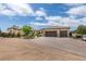 Stunning single-story home showcasing a paver driveway and a three-car garage at 5120 Lone View Pl, Las Vegas, NV 89149