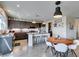 Contemporary kitchen with granite countertops, stainless steel appliances, a center island with seating, and modern pendant lighting at 5120 Lone View Pl, Las Vegas, NV 89149