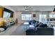 Stylish living room with a cozy sectional sofa and a large window with backyard view at 5120 Lone View Pl, Las Vegas, NV 89149