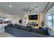 Spacious open-concept living room with a sectional sofa and views of the kitchen at 5120 Lone View Pl, Las Vegas, NV 89149