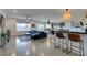 Spacious living room with a large sectional sofa and open-concept design at 5120 Lone View Pl, Las Vegas, NV 89149