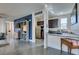 Bright and airy living space with a kitchen and cozy living area with modern furnishings at 5120 Lone View Pl, Las Vegas, NV 89149
