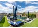 Luxurious backyard pool area with lounge seating and umbrellas at 5120 Lone View Pl, Las Vegas, NV 89149