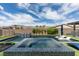 Beautiful backyard pool with waterfall feature, hot tub, and lounge chairs at 5120 Lone View Pl, Las Vegas, NV 89149